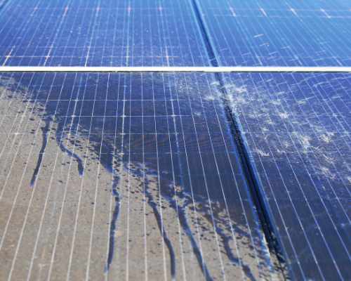 Rooftop solar panels coated in dust and streaks